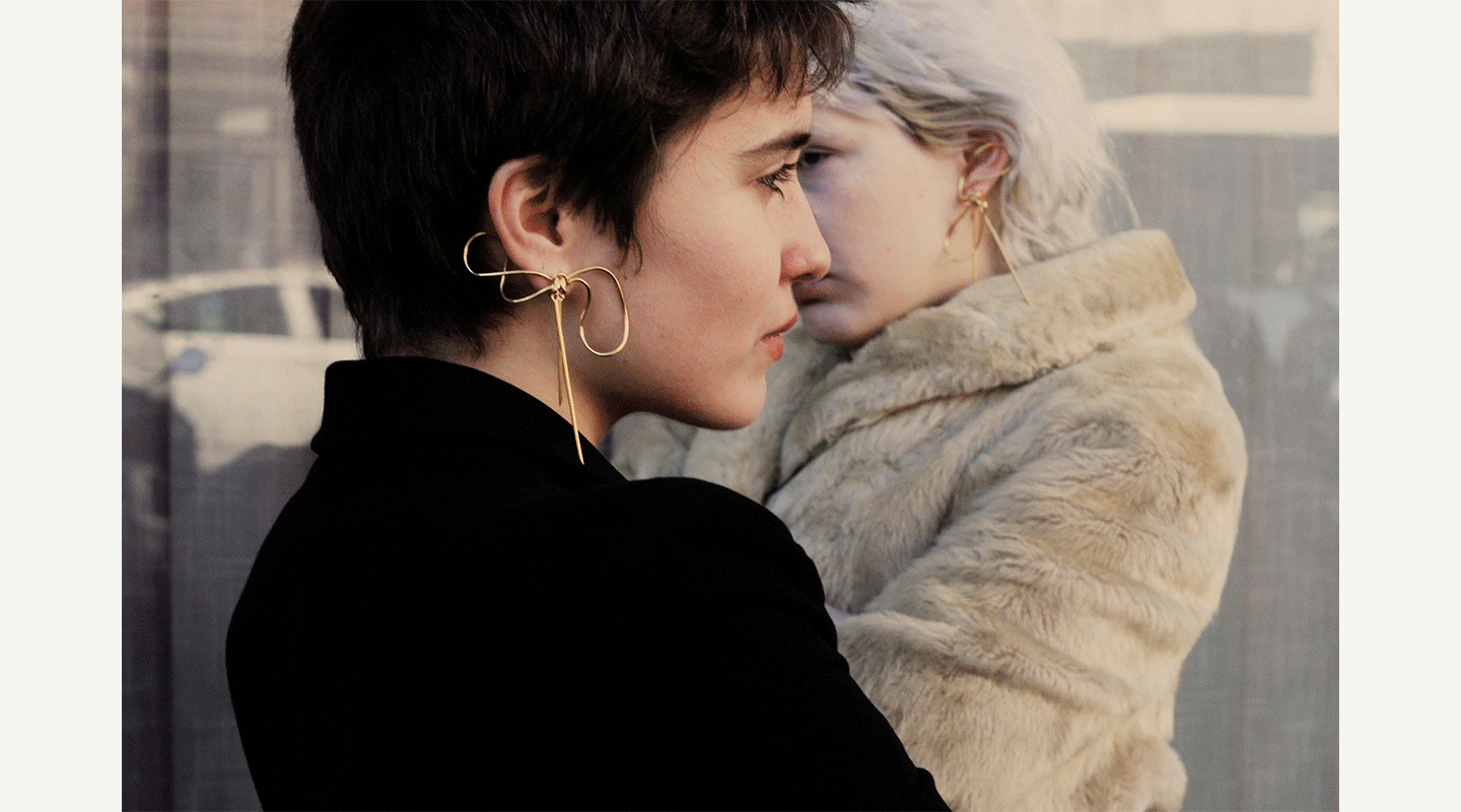 two girls with original gold bow earring