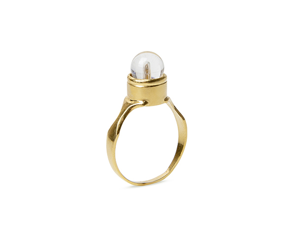 Gold round signet ring set with a clear quartz