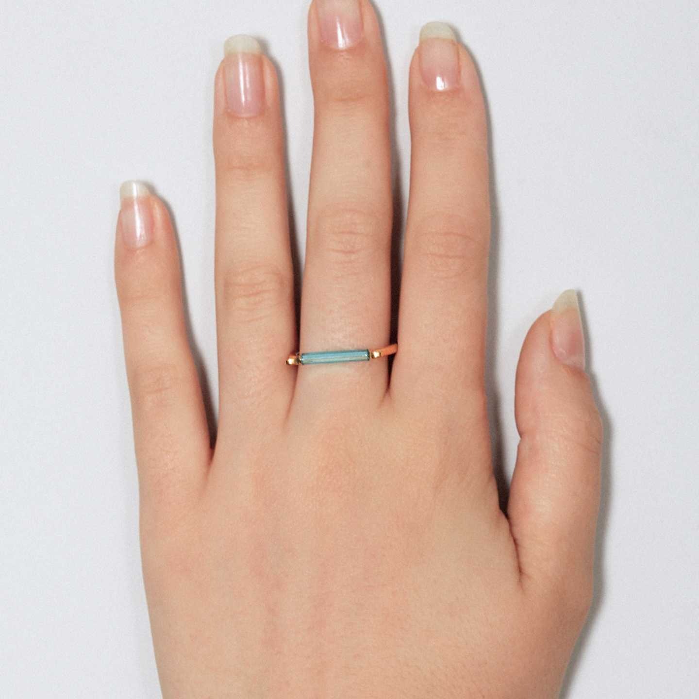 Gold ring with minimalist neon blue bar