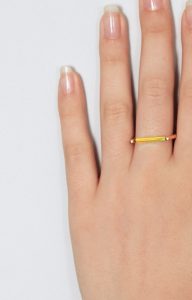 Gold ring with minimalist neon lemon bar
